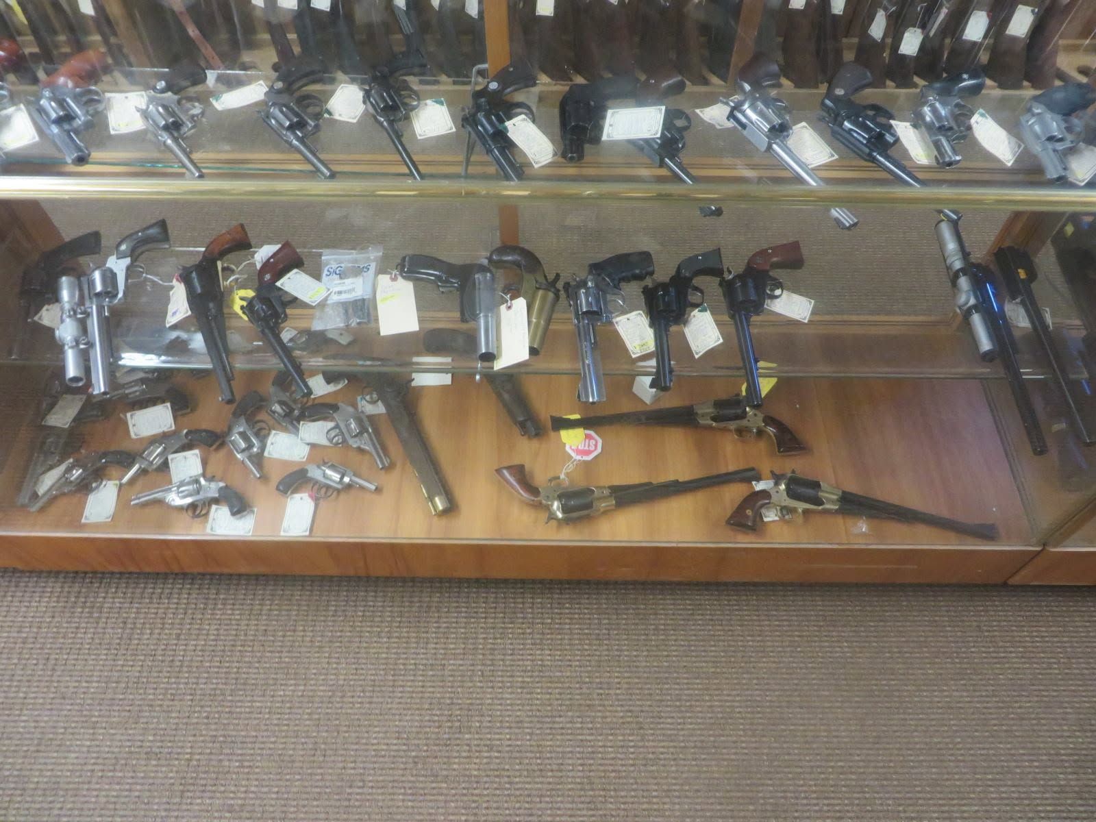 Handguns in the glass display case