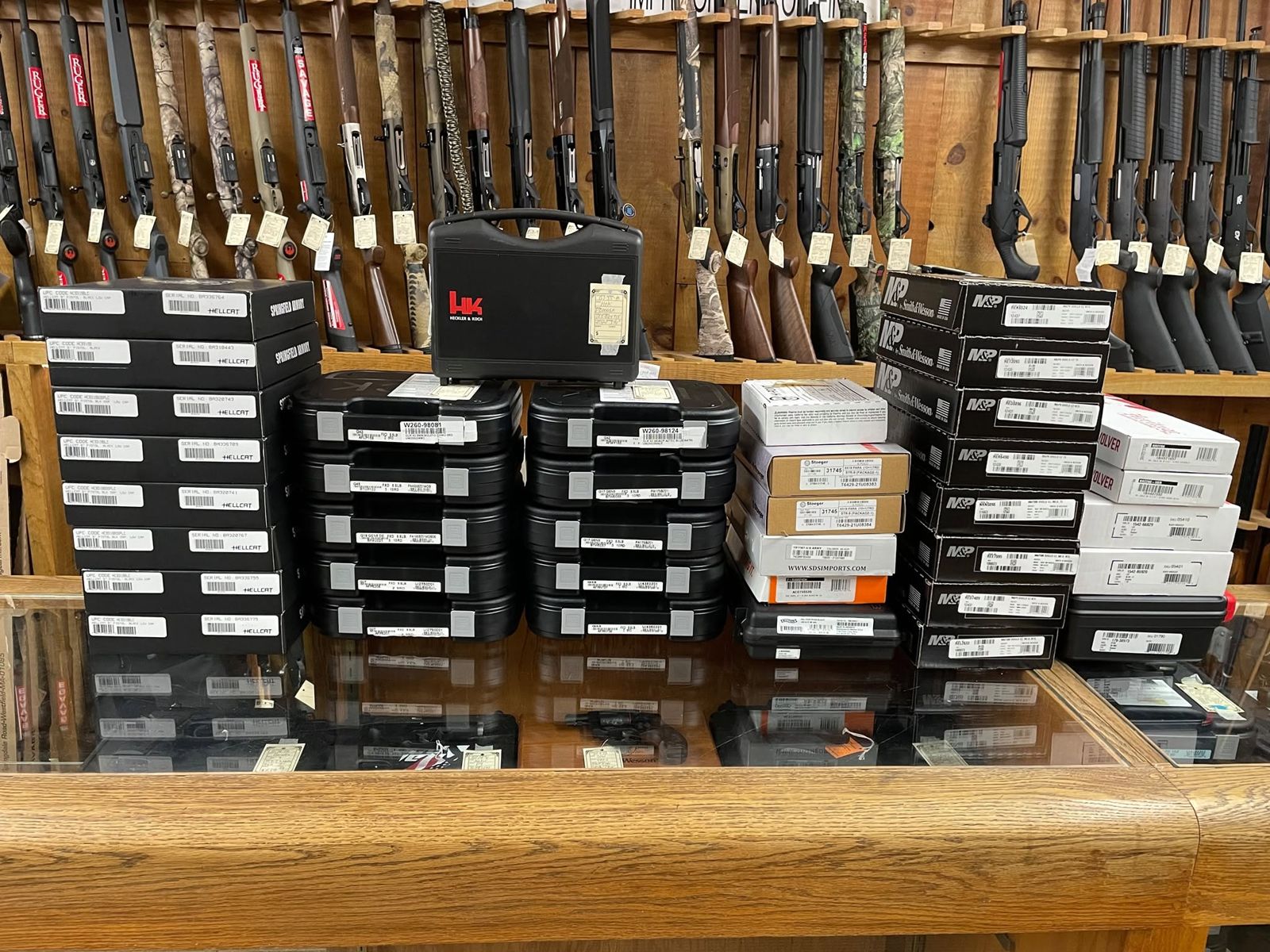 Handgun boxes lined up on the counter