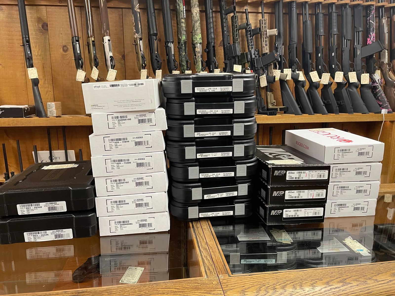 New handguns stacked on the counter