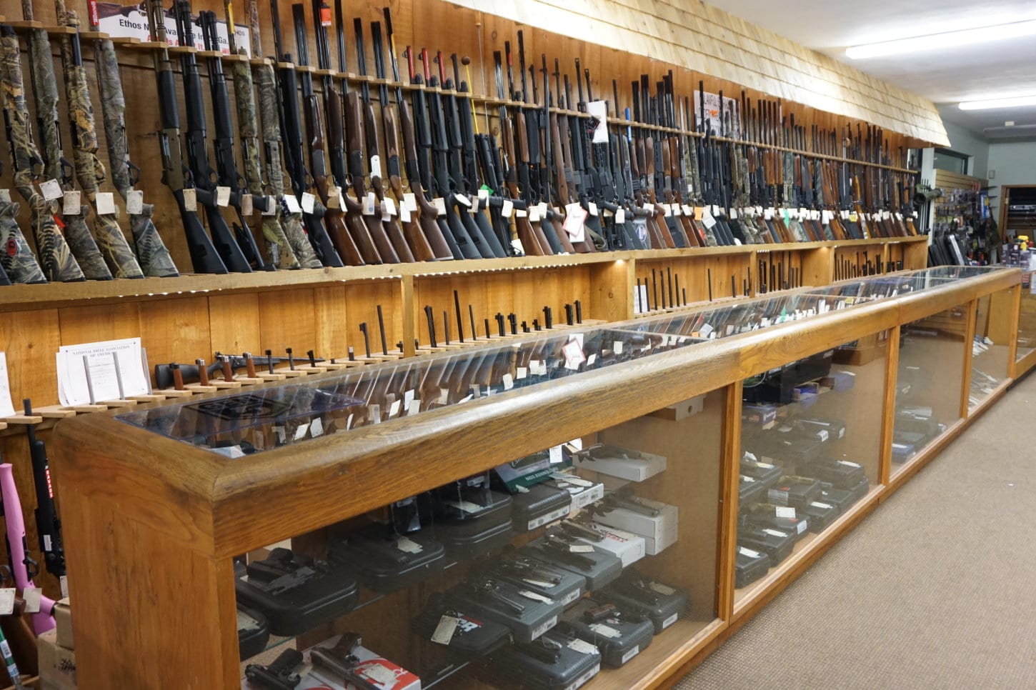 Inside the Sportsmen’s Outpost firearms department in Wolcott